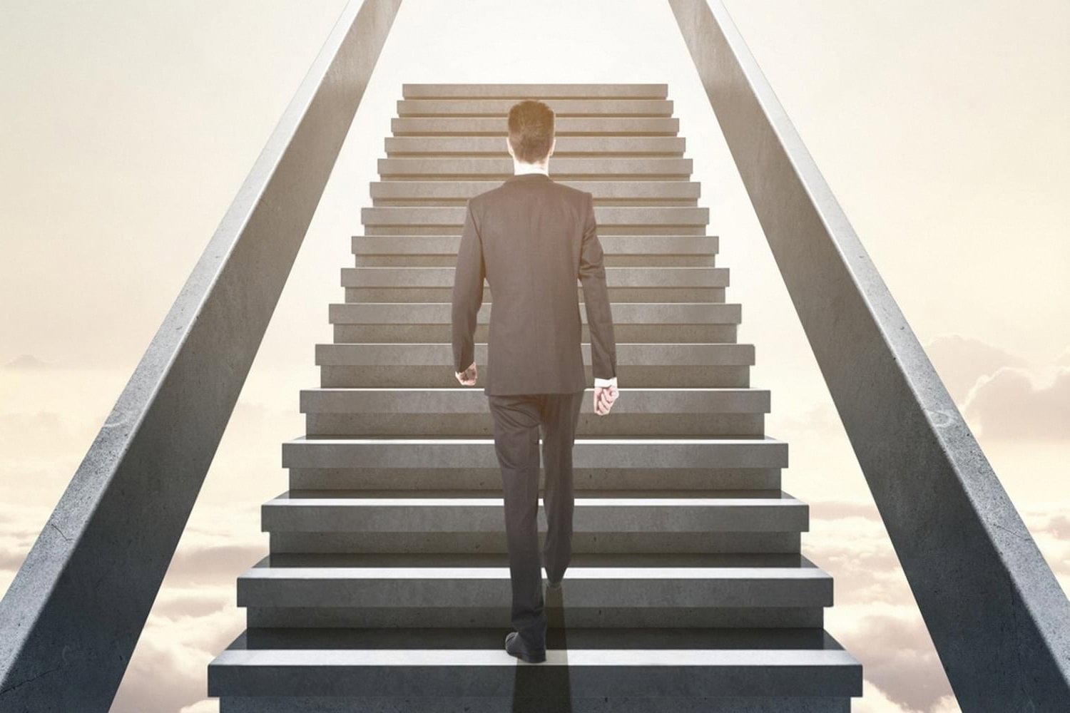 Professional in a suit climbing a staircase symbolising career growth after training